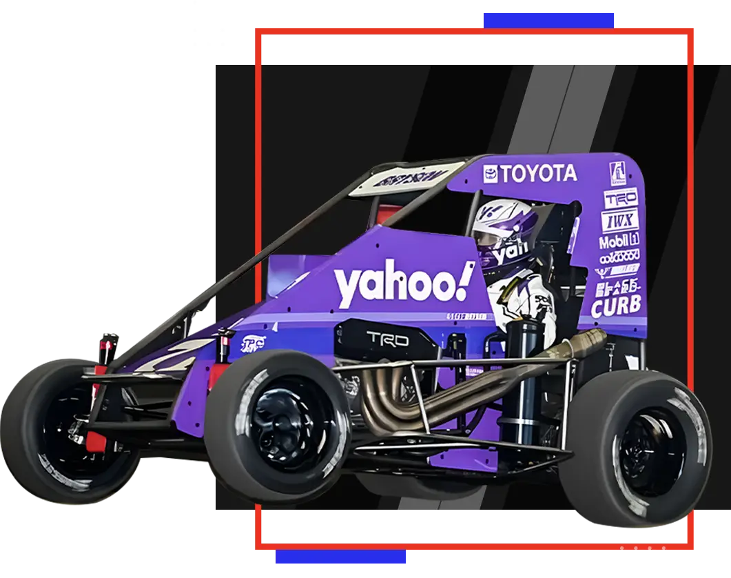 A purple race car with the yahoo ! logo on it.